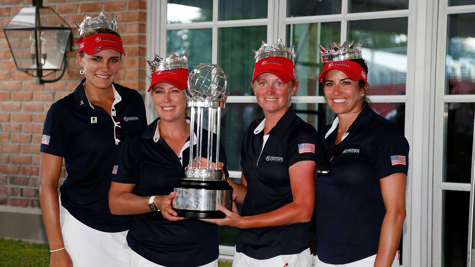 (L-R) Lexi Thompson, Cristie Kerr, Stacy Lewis and Gerina Piller of the United States pose with the champions trophy after winning the 2016 UL International Crown
