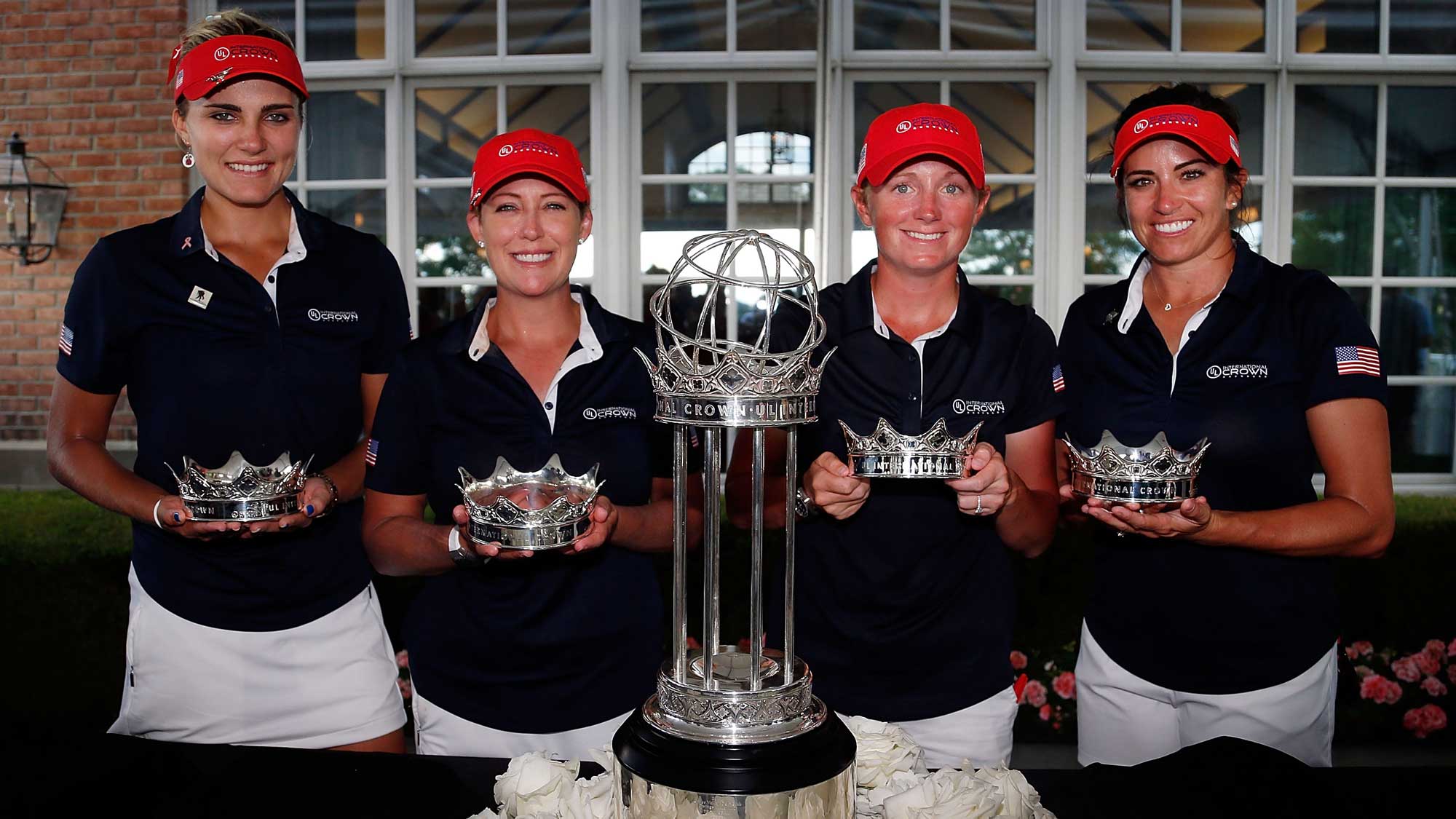 L-R) Lexi Thompson, Cristie Kerr, Stacy Lewis and Gerina Piller of the United States pose with the champions trophy after winning the 2016 UL International Crown