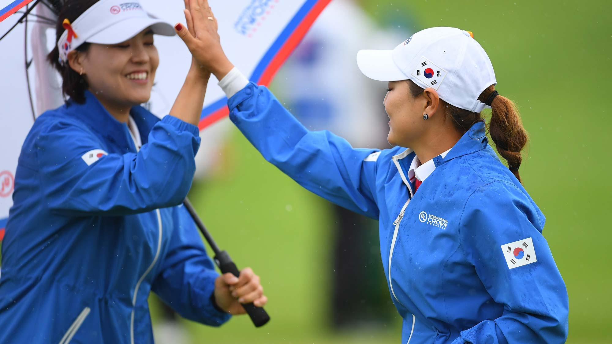 So Yeon Ryu (R) of South Korea celebrates her birdie with In Gee Chun (L) on the 4th green in the Pool A match between South Korea and Australia on day two of the UL International Crown